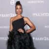 Kelly Rowland wore a black feather gown by Nicole + Felicia Couture.